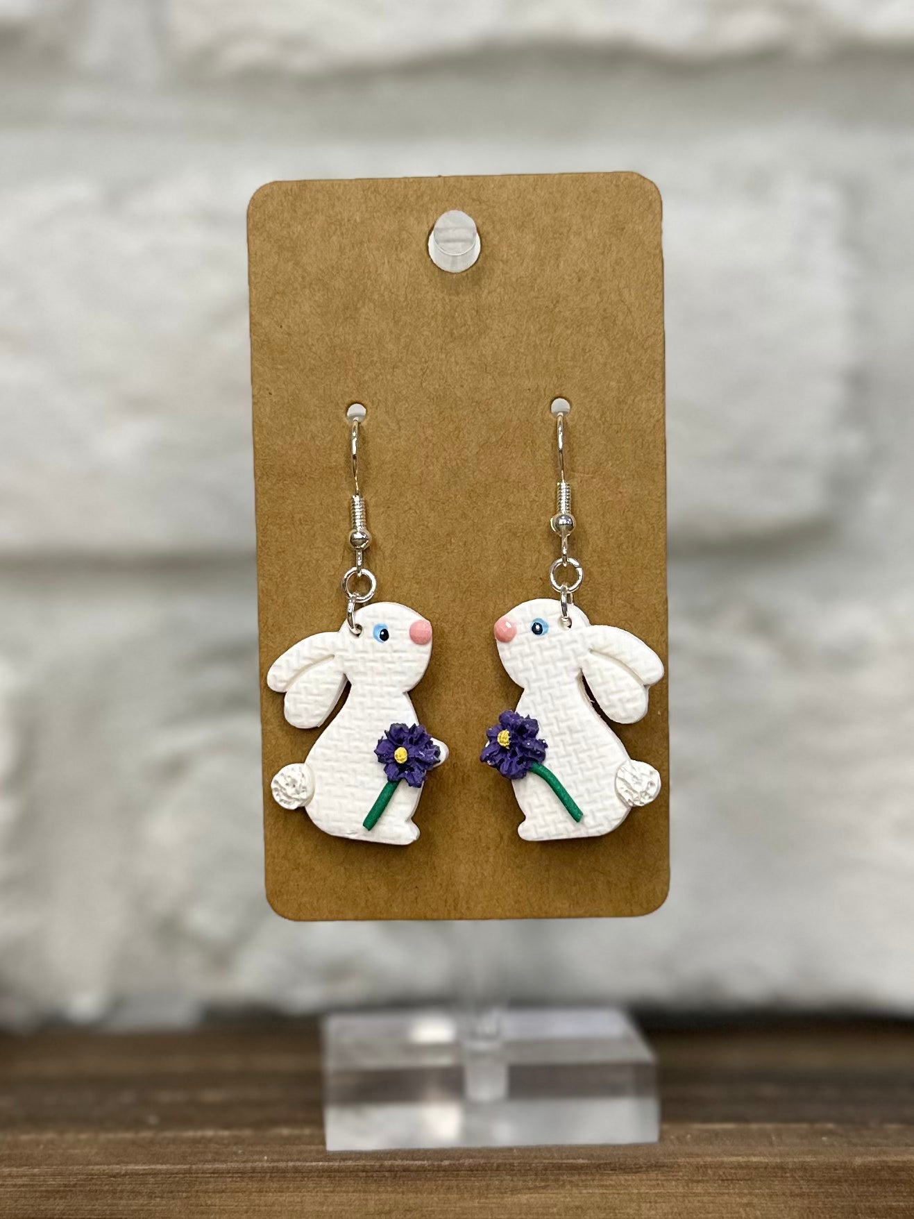 Bunny holding flower