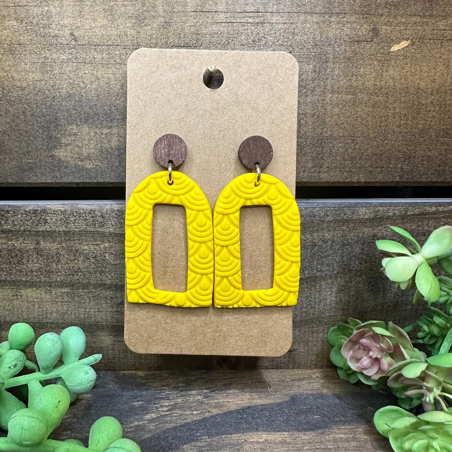 Yellow textured arch with wooden stud